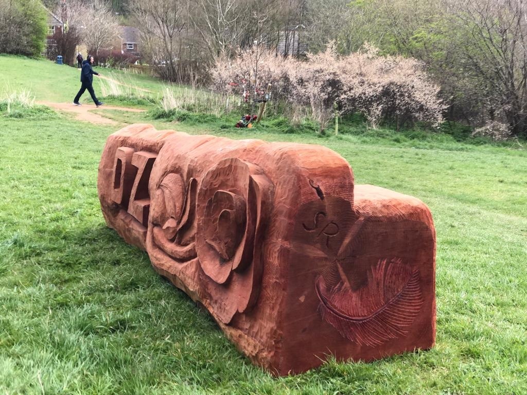 We are pleased to have helped the Stephens family in some small way with the creation of Olly’s bench. 
It is located looking over Bugs Bottom, towards the oak tree that was also planted in his memory. The bench was carved by Steve Radford, a former Council Tree Officer.