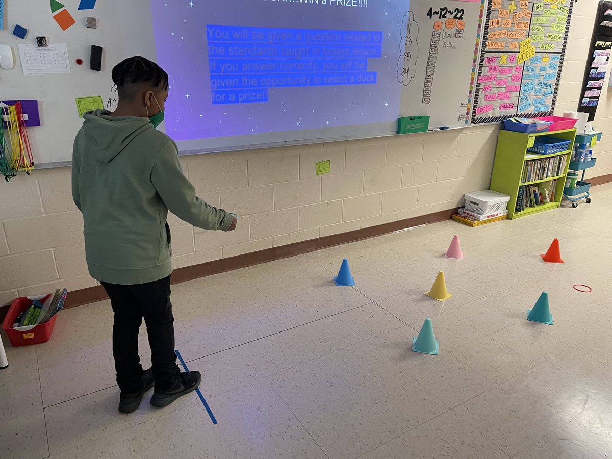 TweetDCS_SIS's tweet image. 3rd grade continues to maximize instructional time while their partners test the gate. Miss Elardo’s students are enjoying a ring toss game to coordinate with their circus themed Bootcamp! #MakingItMatter #TeamDCS