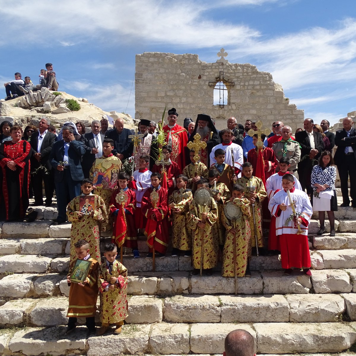 WorldCatholics's tweet photo. In Taybeh, #Palestine's only 100% #Christian village, #HolyWeek is a time of unity, when the three churches come together for a #PalmSunday procession, #HolyFire and family celebration. Learn more: https://t.co/usVaCGwYnI https://t.co/HBLpAI5K3f