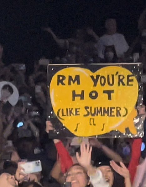 ugh_jules's tweet photo. Namjoon’s reaction to this sign saying he was hot 😭😭 LMAO he is so adorable look at the smile and his dimples https://t.co/c4e38DS8TT