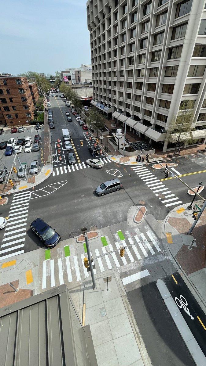 MoCo_DTE's tweet photo. Striping is also starting to take shape at the County’s 3rd protected intersection. 

The south half will have interim corner islands made of recycled rubber, since this intersection will be rebuilt in a few years as part of the Fenton St Cycletrack project. https://t.co/EhedmpNxzr