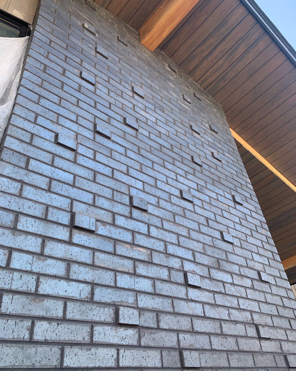 A beautiful blend of black brick, <a href="/SolomonColors/">Solomon Colors INC</a> 94A Iron Black mortar color, and a protruding brick pattern on one of our customers residential projects #architecture #inspiration #masonry #solomoncolors #mortarcolor