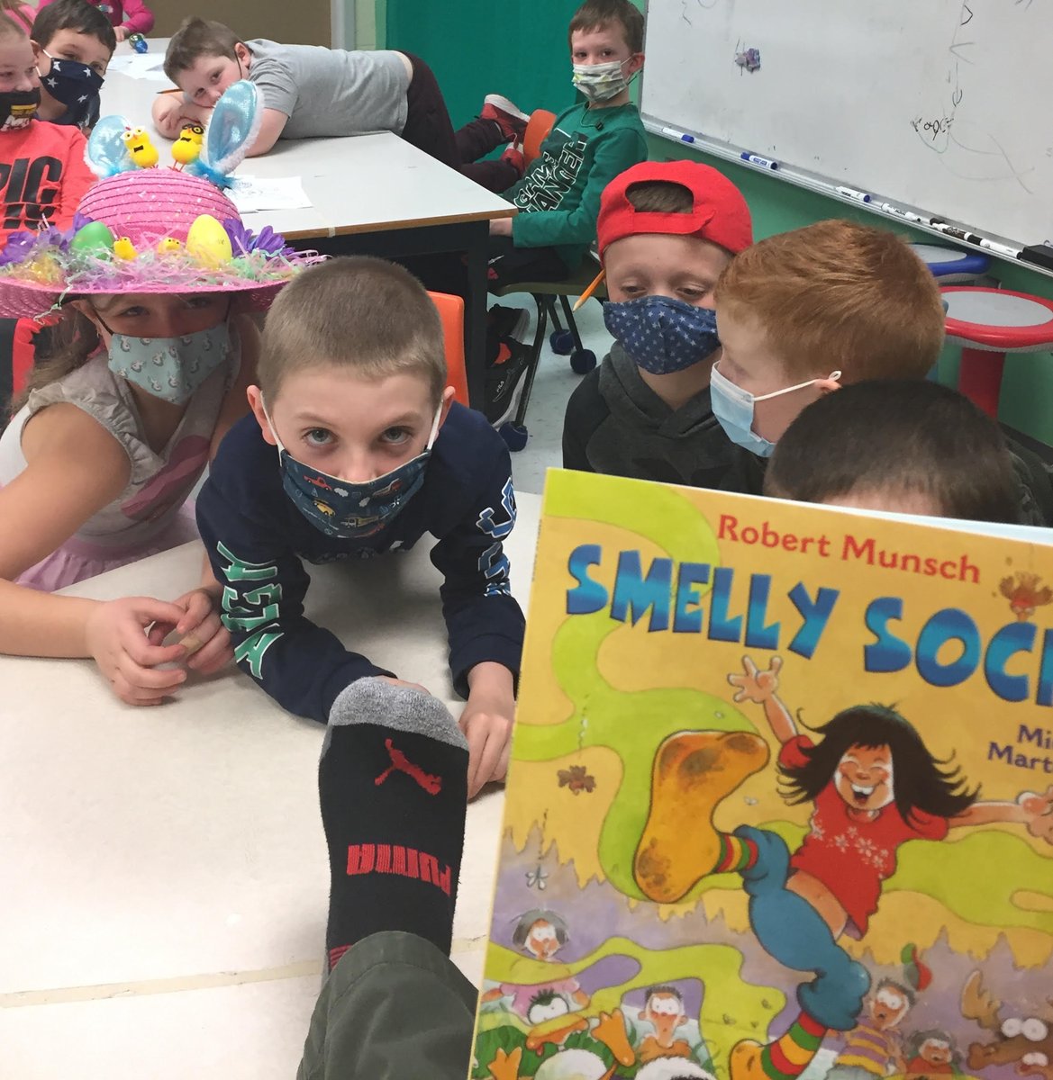 TempletonLearn1's tweet photo. A couple of brave students sitting next to the teacher for the read-aloud!!! @TempletonAcad @NLESDCA #RobertMunsch #smellysocks https://t.co/mLHm8i8Kju