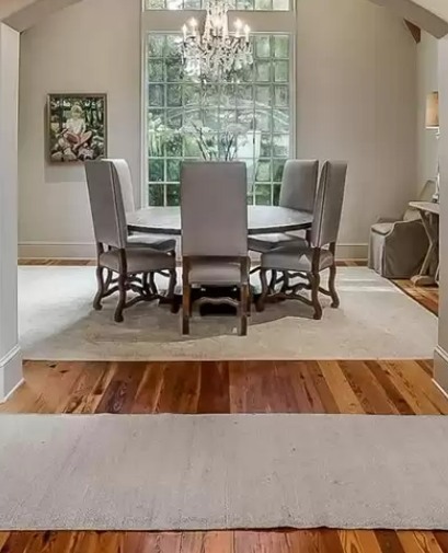 I am in love with this classic look. Antique heart pine flooring is a perfect match with the gray hues in this newly built dining room. Another thing I love are fun facts... One of the most interesting facts about antique heart pine, trees harvested for these floors were gro…