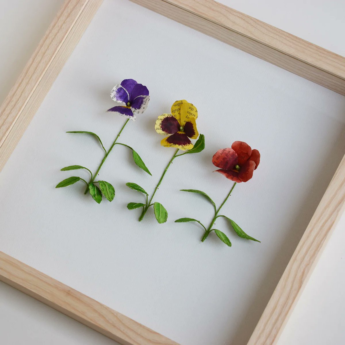 kasasagiDesign's tweet photo. A paper Pansy trio, one of the pieces that has just arrived at @ByardArt for their Home and Garden Exhibition which is on from the 23rd of April until the 23rd of May. #paper #botanical #sciart https://t.co/Tm36tYKvWI