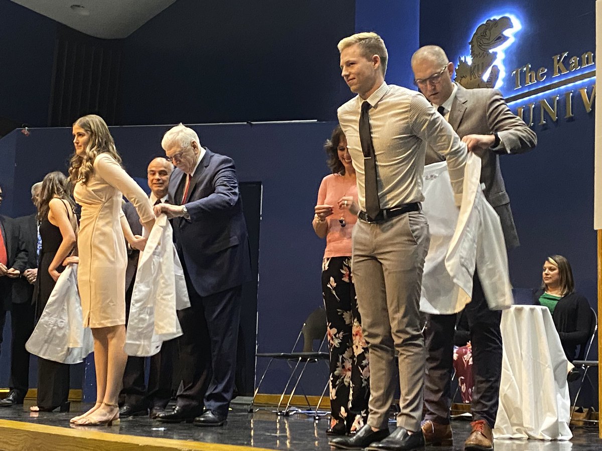KUPharmacy's tweet photo. A special night for 116 Class of 2023 pharmacy students tonight. In front of family and friends, they received their white coats—a right of passage symbolic of professionalism and integrity. Congratulations, Jayhawks! #RockChalk #pharmacy #OurChantRises https://t.co/NKYZomZMI0
