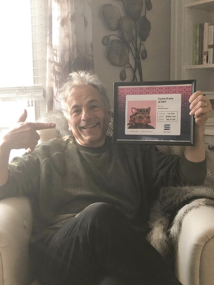 ObsessedDesign's tweet photo. @notsoeasymoney My dad tried to get me to "show" him how to trade NFT's. He looked at the JPEGS and decided it was way too out there for him. So I bought him @TheCyberKatz for his birthday. Not he asks me "How's my Space Cat doing?" #zeow https://t.co/n4TJTHSQls