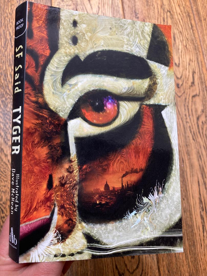 9 years ago, I began writing a book called TYGER...

...and today, I held a proof copy of TYGER in my hands!

It's incredible to see it taking shape. Thank you <a href="/DaveMcKean/">Dave McKean</a> for the breathtaking cover; thank you <a href="/DFB_storyhouse/">David Fickling Books</a> for the beautiful publishing! It's out in October...