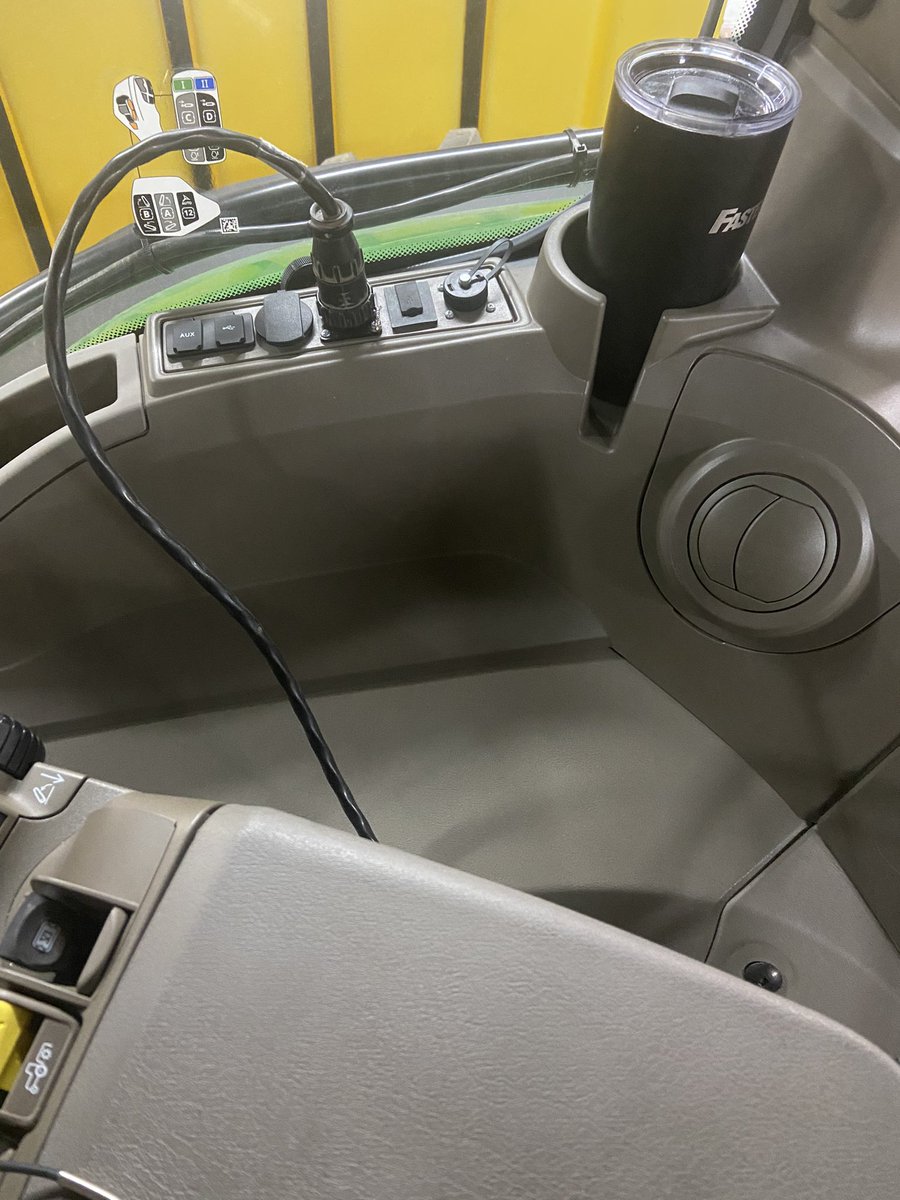 RussOlson16's tweet photo. Ok @JohnDeere Why no more power strip and what’s up with the placement of these convenience outlets? How about a bank below the cup holder or on the back wall of cab below hole to exit cab? 🤔#dontmesswithsuccess https://t.co/S4Ebwr3rSb