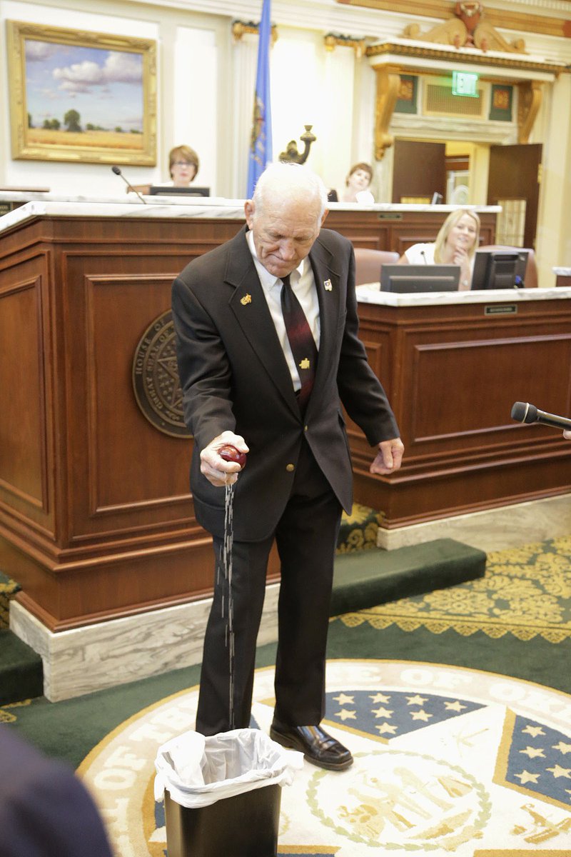 Danny Hodge, a former boxer and wrestler, crushing an apple with his bare hand in the Oklahoma  House of Representatives. (May 2013)