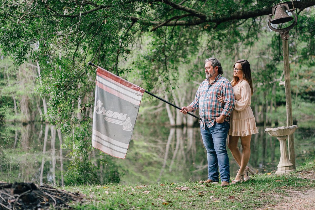 One of my favorite engagement pictures. This is a tribute to my Nana and her flag! She left this world a die hard fan! <a href="/Braves/">Atlanta Braves</a>