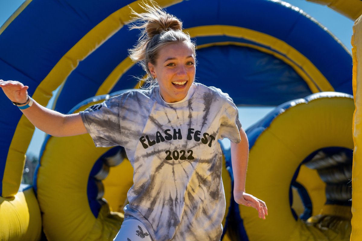 Kent State student enjoys the inflatable attractions at the 2022 FlashFest.