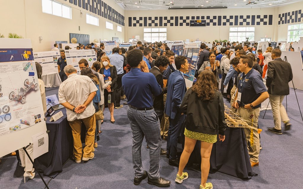 AECoso's tweet photo. Thrilled to celebrate @FIU_CEC students' incredible accomplishments at the Senior Design Project Showcase! Also snuck in a photo with two of my research team's graduating students! Wonderful way to spend the last Friday of the term at FIU. #CapstoneDesign #FIU_ReDes https://t.co/G8u4xTAfFM