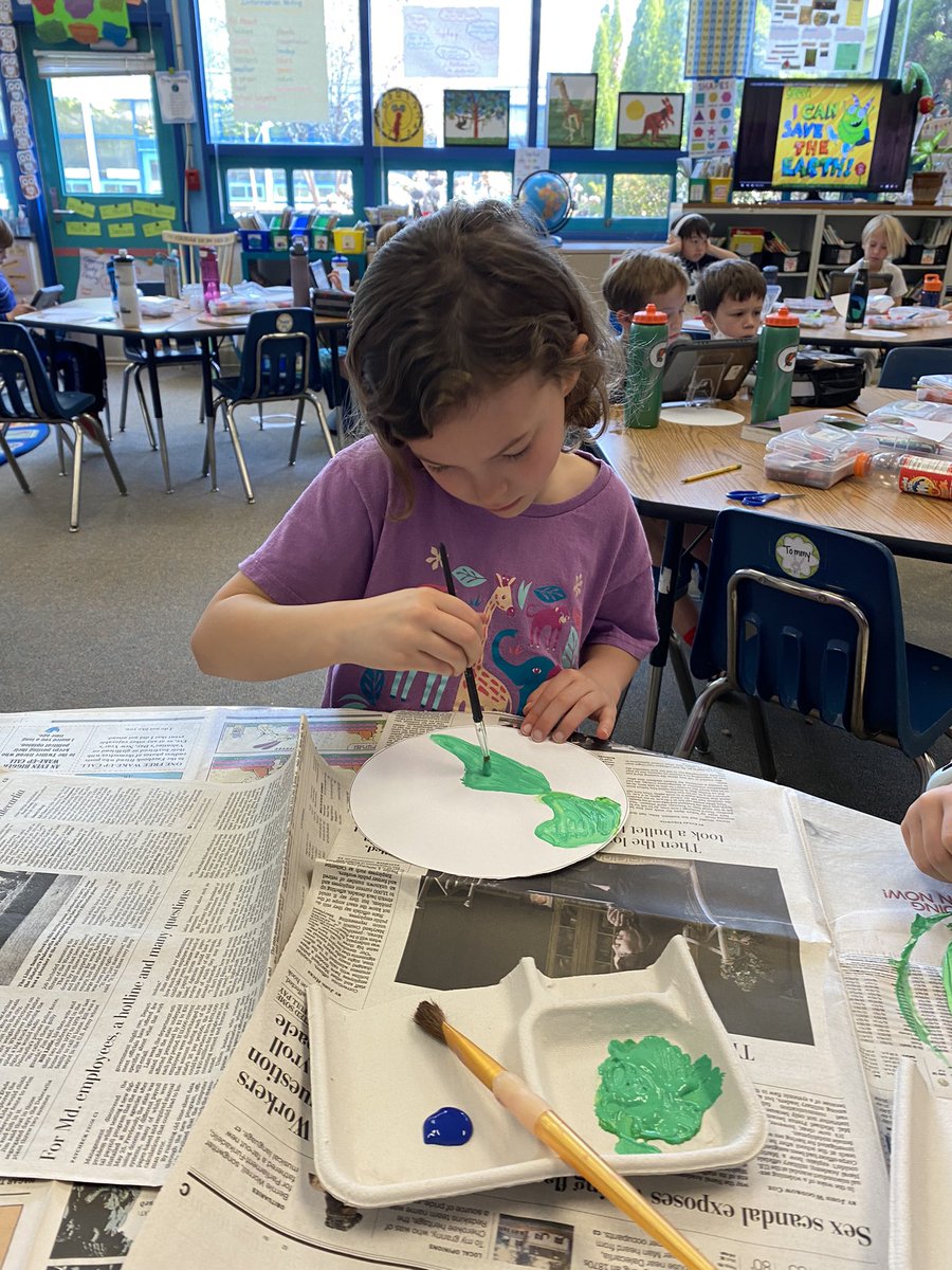 Creating our 🌎 art. 💙💚