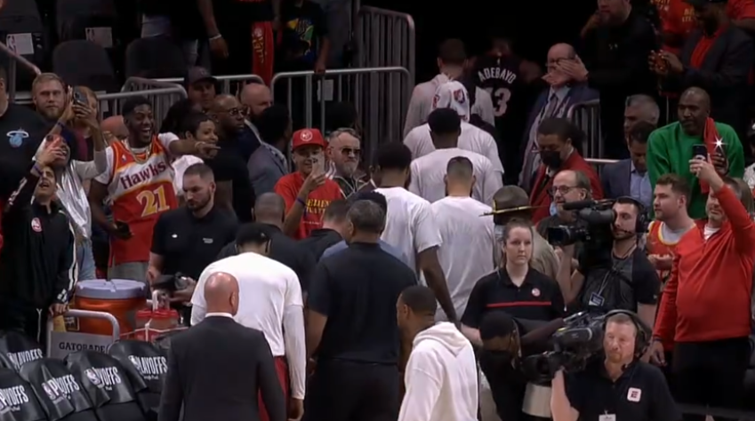 gifdsports's tweet photo. That one Hawks fan pointing and laughing at Heat players https://t.co/182tHZAORB