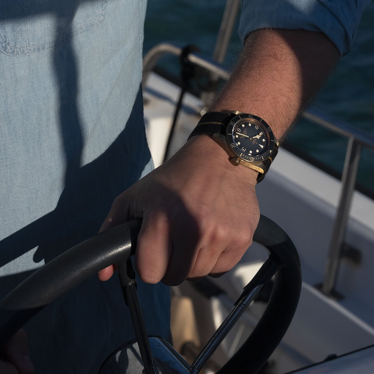 Ocean voyages with the nautical <a href="/Tudor_Watch/">Tudor Watch</a> Black Bay Bronze; a hommage to Tudor's naval heritage.

The Tudor Black Bay Bronze, 43 mm bronze case, fabric strap, manufacture calibre MT5601 (COSC). 

🛍 bit.ly/3OeEdC0

#TudorWatch #BornToDare