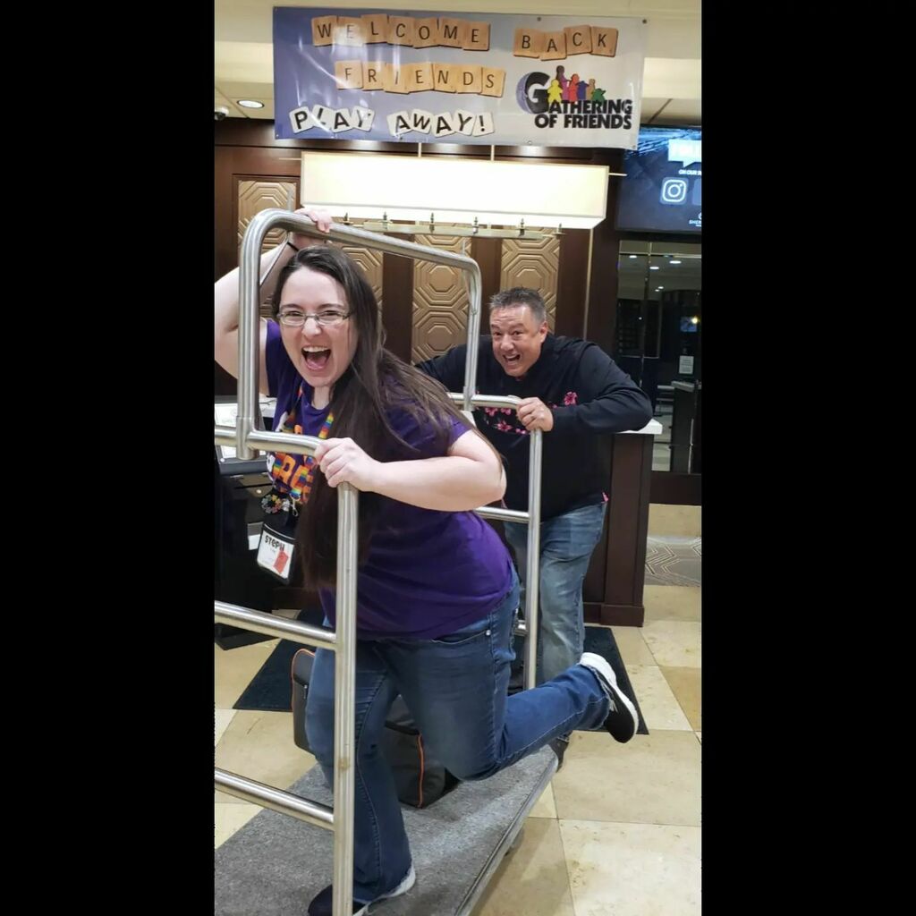 BoardGamerSteph's tweet photo. Never a dull moment when @ryanmkb is around! I love our epic #stephandryanconpic for each con we go to and this time Gathering of Friends! One of our best pics I think too. #gatheringoffriends #bgg #Allthegames #newgames #conpic https://t.co/tz2mZKKhKo