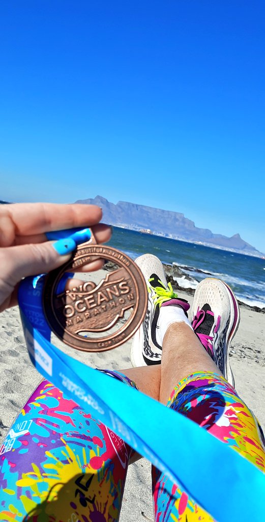 TrainerThee's tweet photo. What a day to #race! #TTOM2022 @2OceansMarathon #HalfMarathon #FastestMile #Fastest1KM #Fastest5KM The sky is azure blue, but don't be deceived, it's a strong & #icyCold wind! #Cheese & #Malbecwine may be my new #preRace diet...Now, a cupcake 🧁 & choc milkie! #Born2Run #blessed https://t.co/eJKkzYdAF5