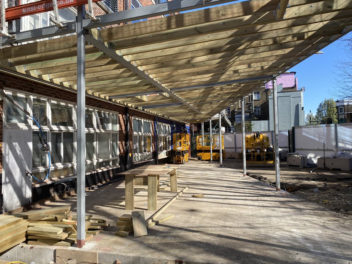 morleynkren's tweet photo. The sun is shining on our new renovation. 

The steel framework and timber roofing of our new front extension are now up. In a few months time this will be part of our new welcoming entrance and large public cafe space. 

#construction #renovation #2022Goals https://t.co/jaKR7nSIc5