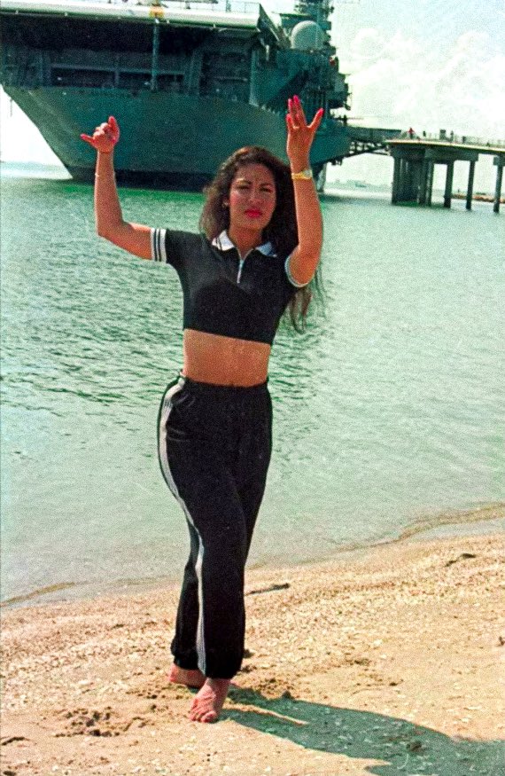 VisitCCTexas's tweet photo. Happy Birthday to Corpus Christi legend &amp; the Queen of Tejano, @SelenaLaLeyenda ! 🌹 We love this vintage photo of her dancing on North Beach w/ the @LEXCV16 in the background ⚓️🏝 https://t.co/2SORkVMX7b