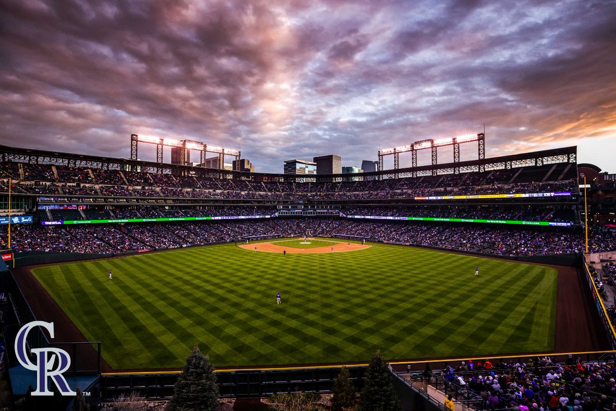 This is a tweet about photos of the @Rockies @CoorsField. You're welcome. 💜