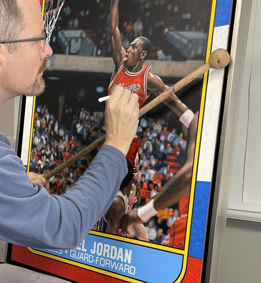 PostartPost's tweet photo. I finally made the jump into other sports. Just finished painting MJ's #rookiecard. Had fun painting it, but that crowd was a monster! Now it's off to my client—hope he loves it! #MichaelJordan #mj #THEGOAT #chicagobulls #thelastdance #sportscards https://t.co/K4OCSwwPQs https://t.co/lAP2bv6J9Q