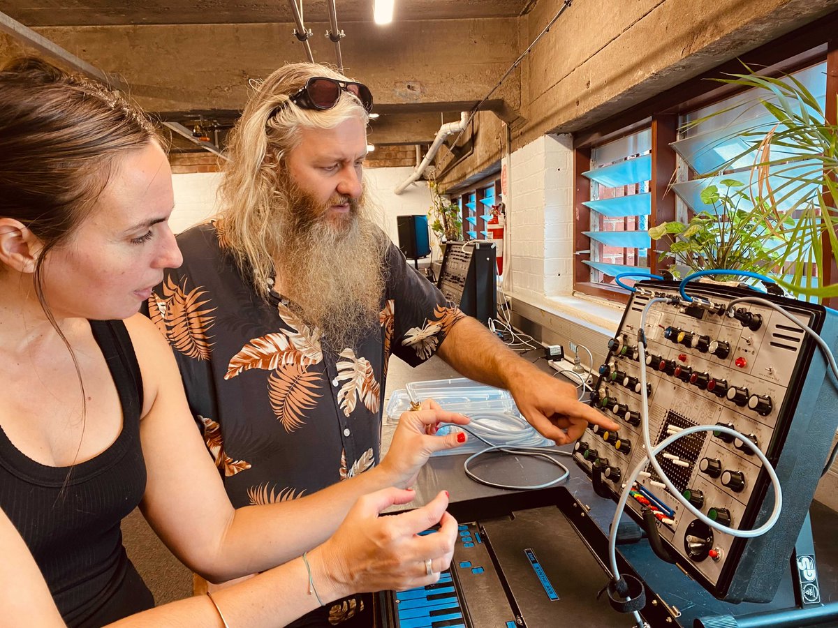 mess_ltd's tweet image. Did you know that it is always warm and sunny in the MESS Studio?! Here we find Kat Stathis diving deep into the Synthi Aks with MESS Co-Artistic Director Robin Fox during a particularly balmy session with the #emssynthiaks 
​
​#messcommunity #messltd