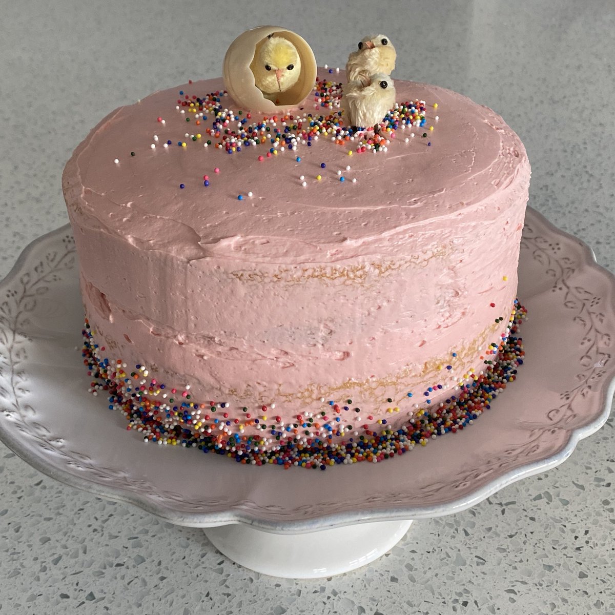 Sushie213's tweet photo. The decorations on top are from the 70s. Mum was cleaning out cupboards & bequeathed the wee chicks to me. Happy memories! Will cut into the cake tomorrow…🤞🏻it tastes good! I only taste tested the buttercream. 😂 #lovetobake #eastercake #lotsofbutter #buttermakeseverythingbetter https://t.co/B4Nyyd6afM