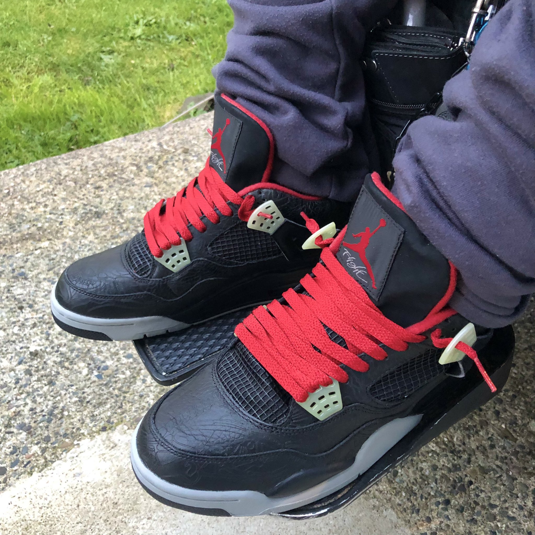 Air jordan 4 2025 black laser on feet