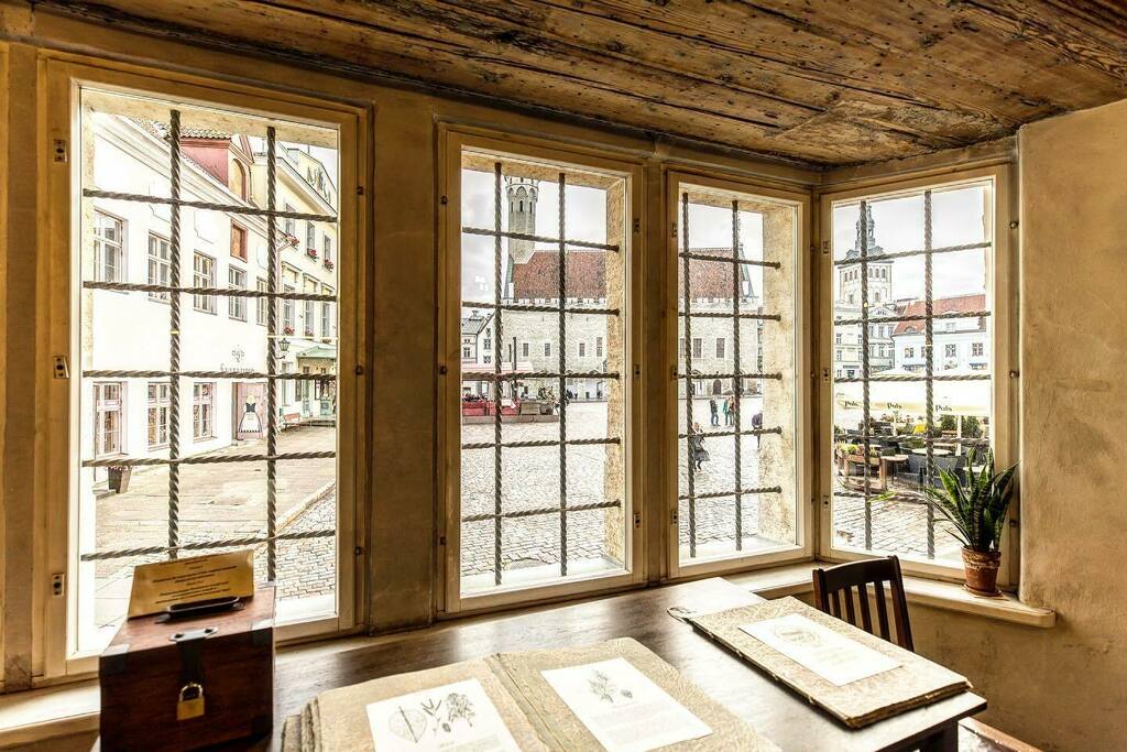 DennisRPhoto's tweet photo. Looking through the windows of a nearly 600-year-old pharmacy into the Town Hall Square in Tallinn, Estonia.  I’m really missing travel lately, and I worry for the Baltic countries such as Estonia during this damn war!  All my love to 🇪🇪 #Tallinn #Estonia #baltics #oldtown #… https://t.co/MYPgCCdZXp