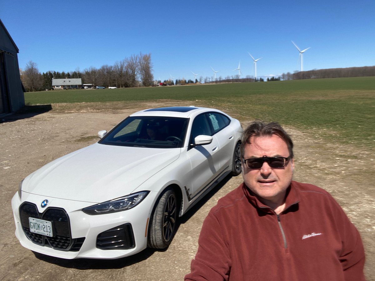 EVRevShow's tweet photo. My last day today with the lovely @BMW @bmwcanada i4 eDrive40! Cool and windy day, but nice enough to go for a country drive and check out some local wind turbines! Zero impact energy generation and zero emissions! The future is bright! #EVRevolutionShow #ElectricVehicles https://t.co/f4loWc17s5