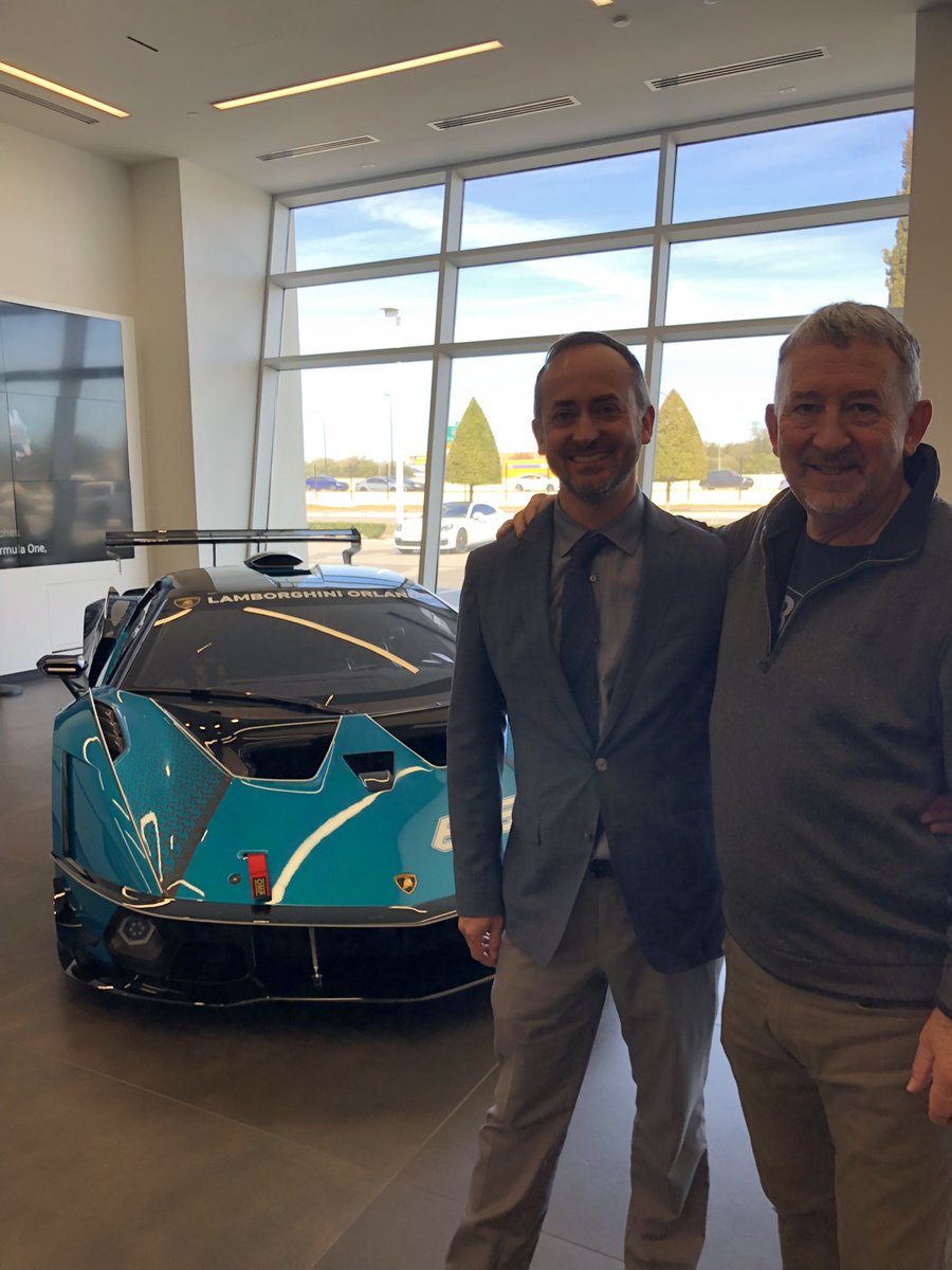 PeterFrater's tweet photo. @jack_rix Happy birthday Robbie  (and hi Jack…long time…etc). Thought I’d show you a pic of me visiting my son Ashley in Orlando where he’s the Lamborghini Brand Manager at the Rolls-Royce, Bentley and Lamborghini dealer. What a lousy job, eh Robbie? https://t.co/81uEdEFxJN