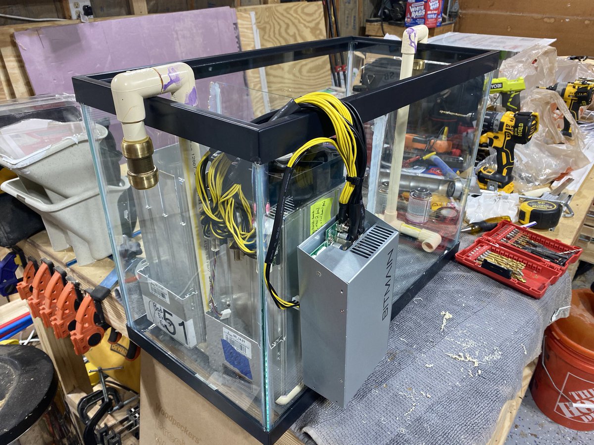 Schnitzel's tweet photo. Inlet and outlet done, also added the separation wall that allows the tank to just work with 2 miners in the beginning. #bitcool will overflow the miner side to the outlet side #btcwaterheater #homemining #immersionmining https://t.co/r0pF1CAAEP