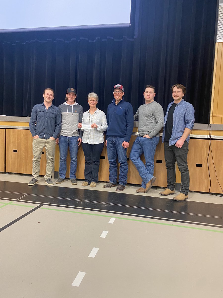 HawksPHill's tweet photo. The Hawks present ⁦@PHill_CC⁩ president Marion Hougham with $1,000 donation. Congratulations on a successful auction and burning the mortgage. 🔥 https://t.co/HZCNgK4UdM