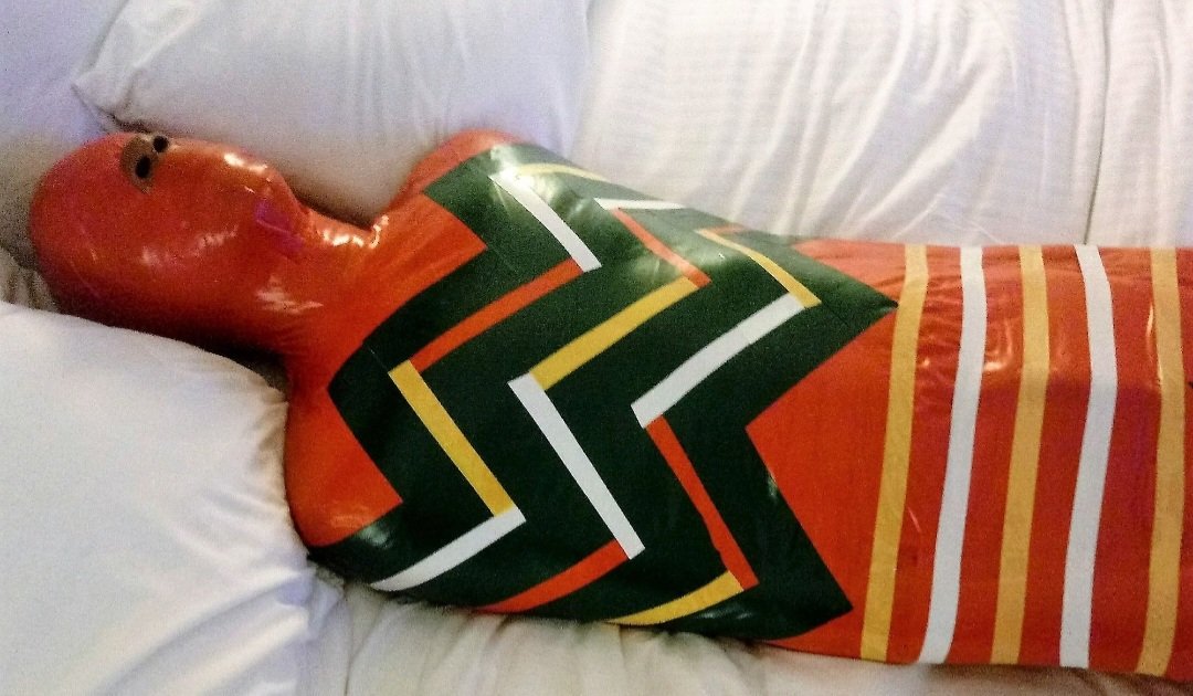 Sir_LatexMan's tweet photo. In 2018, I was a mummified Christmas present! This happened on Halloween Day. I even experienced breathplay while wrapped up! Wrapped by RebekahDementia
#MummificationMonday https://t.co/g0mZApsAnR