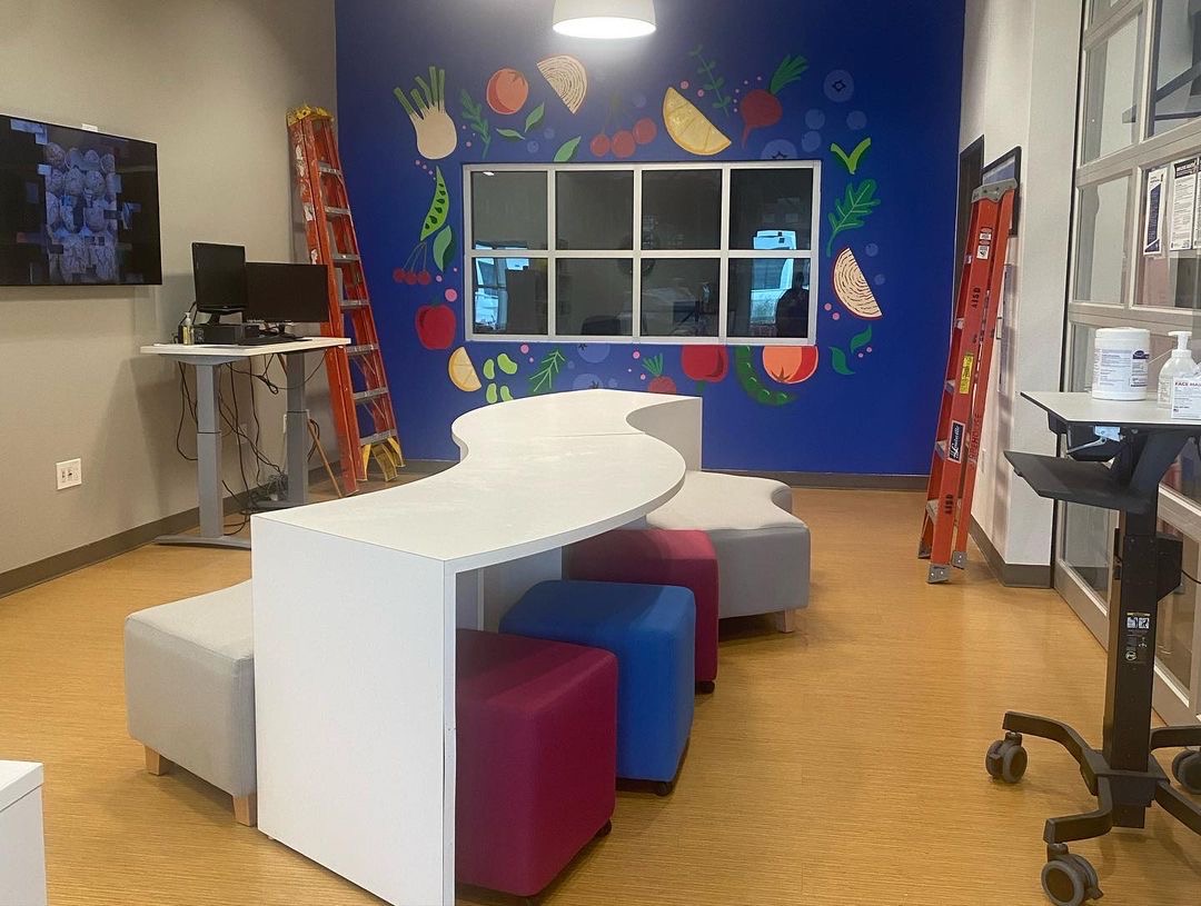 AustinISDFood's tweet photo. We have a beautiful new addition to our office at the @AISDwarehouse! Big thanks to @mslaneart and her @AustinCrockett students for painting this amazing mural for us.  We provided the blank slate, and the students created this fruit and veggie masterpiece🎨🍎🥬🍊 #AISDProud https://t.co/J4rXsmDTYm