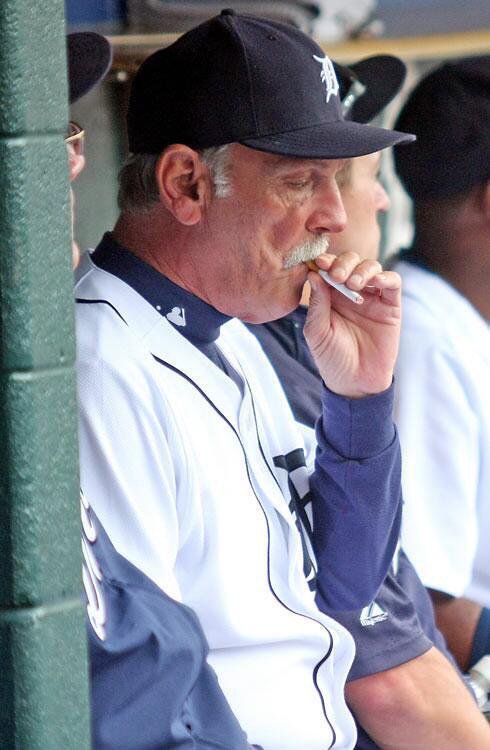 baseballinpix's tweet image. Jim Leyland smoking in the dugout during a game, 2009