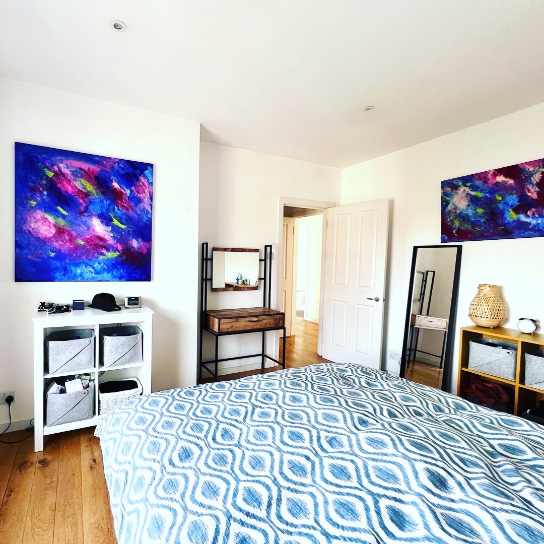PatternAbstract's tweet image. Deep ultramarine blue collection of paintings up on the bedroom walls. They look great above the white storage unit, go well with the wooden flooring and the industrial style dressing table. They create a peaceful and relaxing vibe in the room, great space for a good night sleep.
