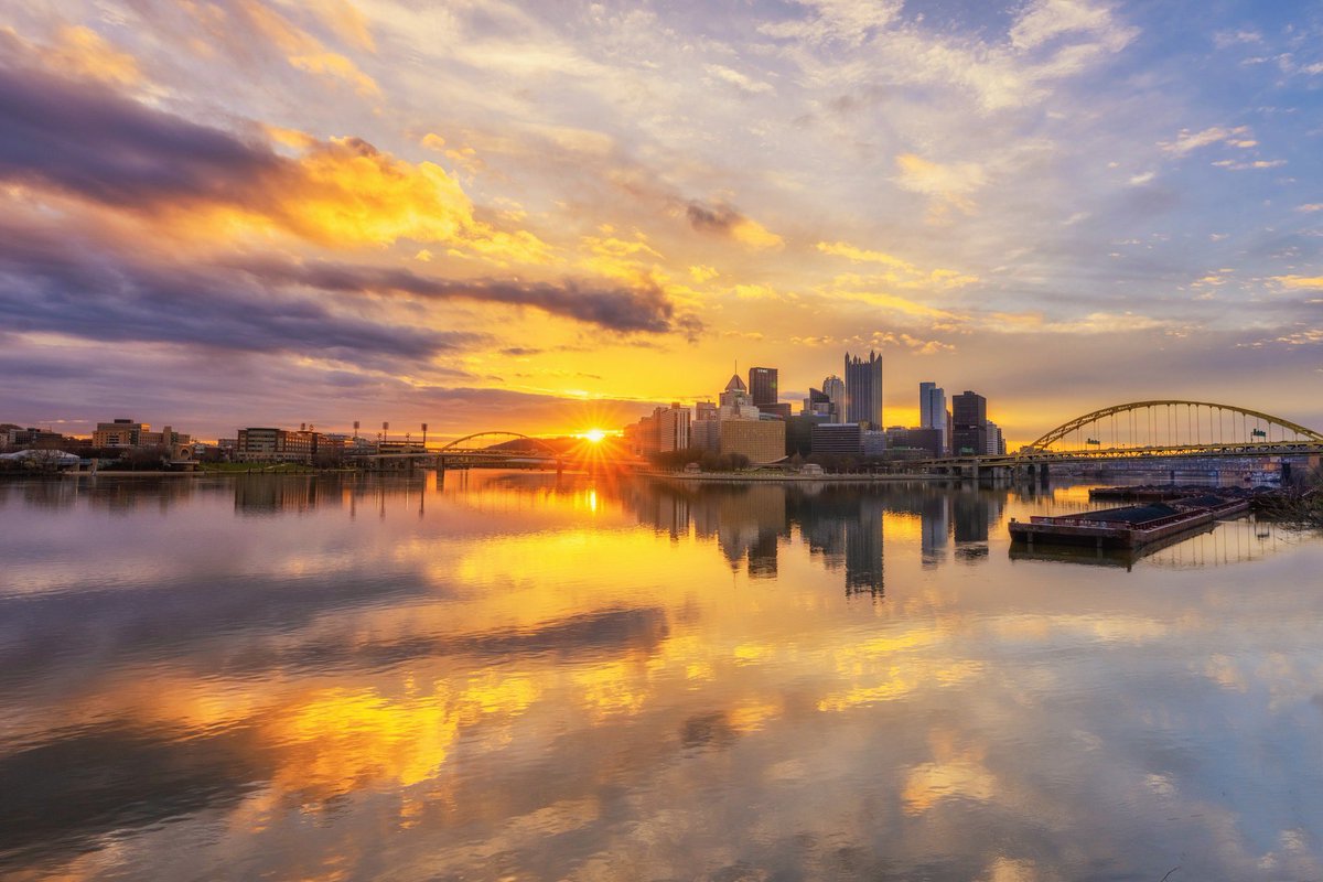 DaveDiCello's tweet photo. Even after the color faded from that amazing sunrise last week, when the sun made its way between the clouds, it was a pretty incredible scene. The edge of the top clouds caught the light, and with the rivers reasonably still, the reflection of #pittsburgh was an added bonus. https://t.co/UfpzFM8hJ8