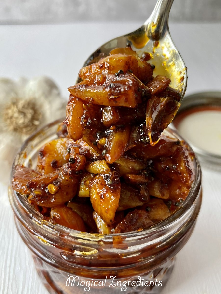 Spicy Garlic Pickle - This delicious and spicy pickle is the perfect accompaniment grains or flatbreads, parathas, or stuffed parathas. #garlicmonth #nationalgarlicday #garlic #pickle #garlicpickle #indianpickle #spicy go.shr.lc/3Okrg9V