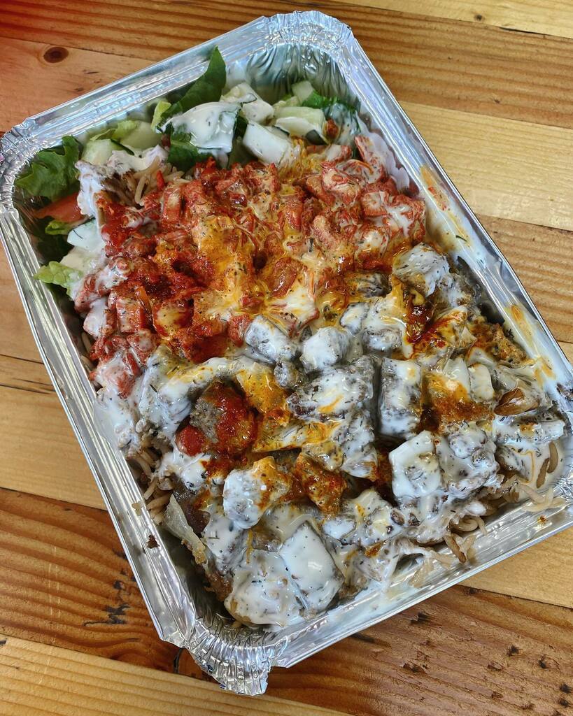 The sauciest 👅 // chicken &amp; gyro over rice and salad with extra white and spicy sauce at District Chicken &amp; Gyro (DCG) in Tyson’s, VA