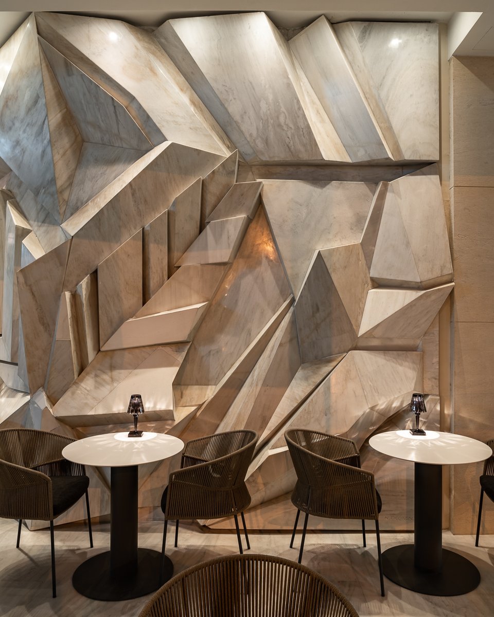 The #abstract #marble is enhanced by accent lights that emphasise the form and #texture. The #play with #light and shade completely transforms this piece of #art!

Hotel: Athens Capital Center Hotel
Interior designers: <a href="/mkvdesign/">MKV Design</a> 
Photography: <a href="/GavriiLux/">Gavriil Papadiotis</a>
