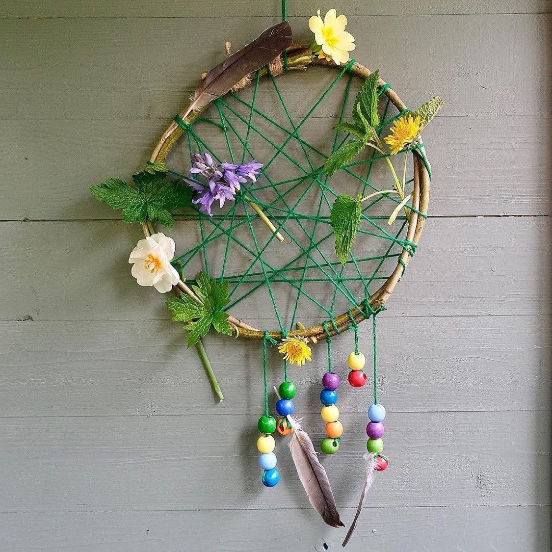 MudandBloom's tweet photo. Another beautiful dreamcatcher 🌿🌈

This is one of the activities in our April box. You can make it using willow or dogwood sticks decorated with leaves, flowers and feathers. We provide cotton yarn and colourful wooden beads. 

📷 @ puttputt82 
#naturecrafts #outdooorlearning https://t.co/6JS4wwYubF