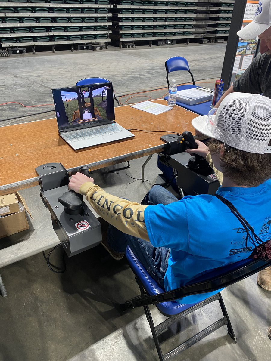 TbhsTech's tweet image. Construction Trades classes at the Build My Future convention.   Some of our students driving a simulator for a dozer and excavator.