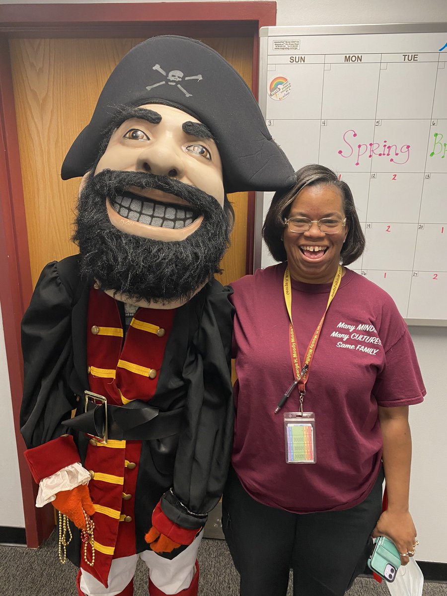 School Security Officer, Mrs. Jefferson, and Patch are keeping the eggs for the belated egg hunt nice and safe for this afternoon's faculty meeting.
