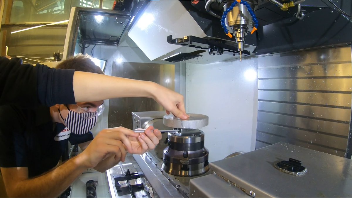 PurdueBechtel's tweet photo. Using the 5-axis CNC machine in Gene Haas Manufacturing Lab. Here you can see the application of the 4th and 5th axis of the CNC machining. These operations are performed by the application of dovetail clamping provided by Raptor Work holding. https://t.co/5xLp248bbM