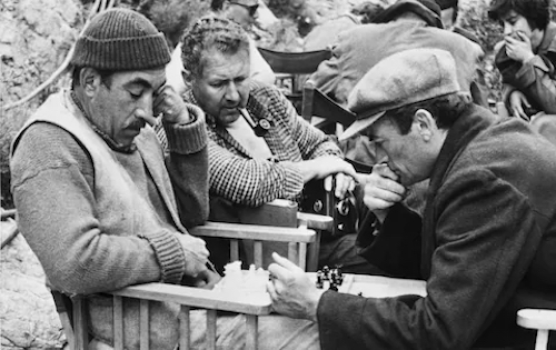 Anthony Quinn and Gregory Peck playing chess on the set of The Guns of Navarone (1961) that premiered #OTD.