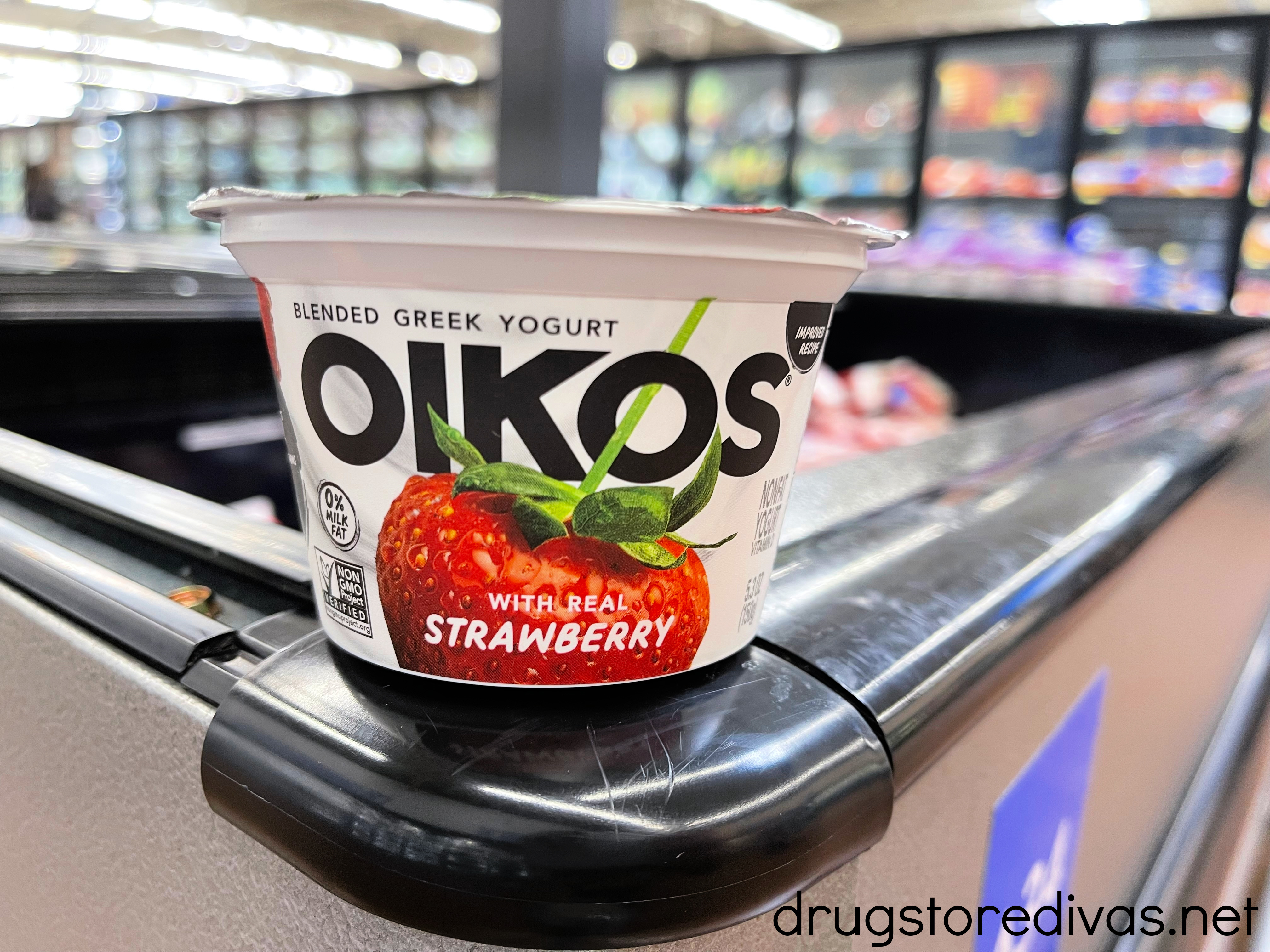 An Oikos yogurt container in the store.