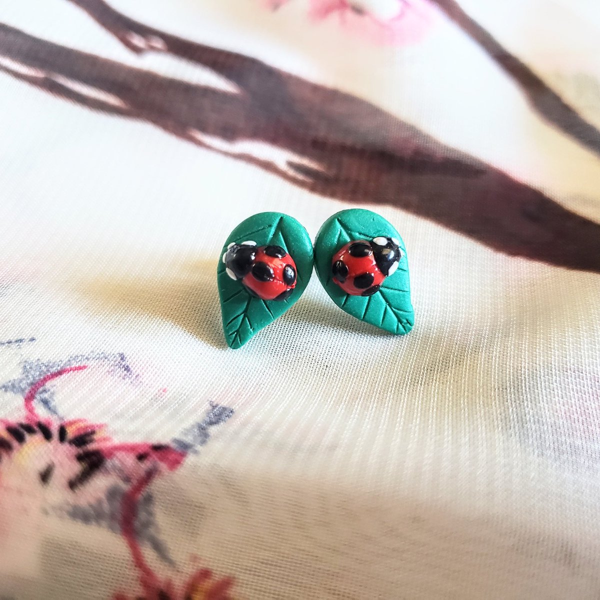 Look! A little ladybug on a leaf! These tiny leaf studs will be added to my shop tonight! #ladybug #bugjewelry #insectjewelry #leafjewelry #leafearrings #studearrings #polymerclayearrings #handmade #shopsmall pearlsandarrows.etsy.com