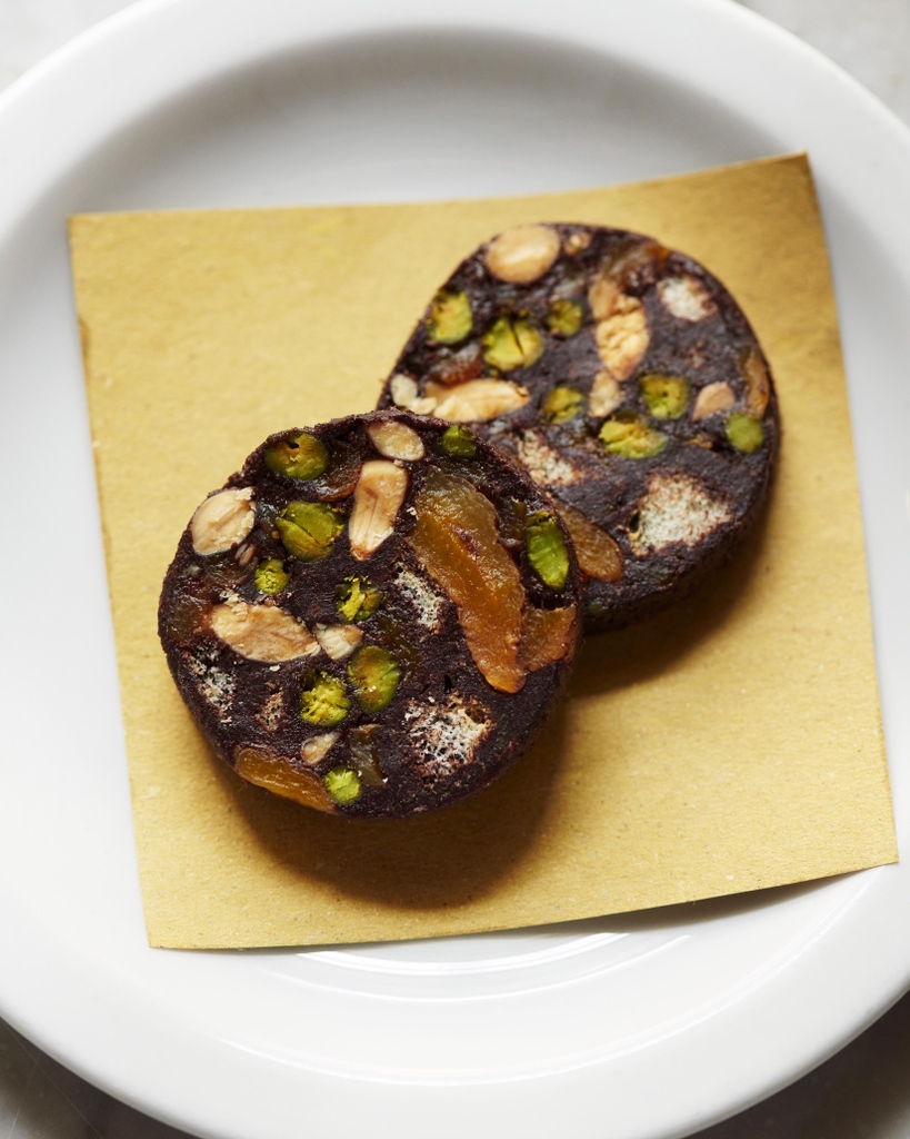Chocolate salami. A combination of mixed nuts, candied fruit, ladyfingers and cocoa, perfect with coffee.⁠ #chocolate #candiedfruit #mixednuts #italiandessert